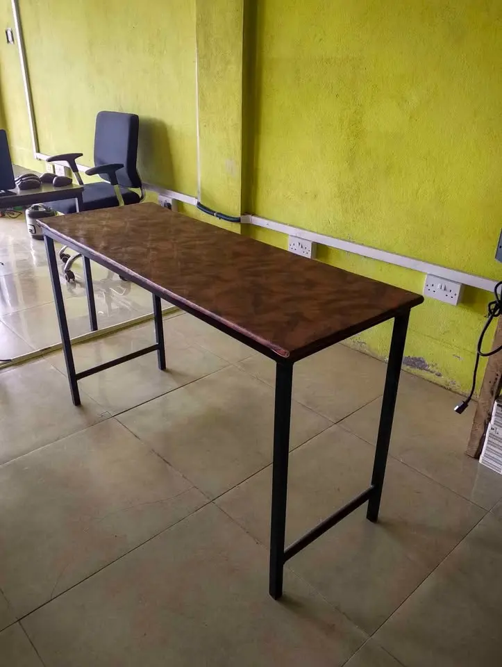 Iron leg table with leather top in Paynesville