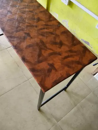 Iron leg table with leather top photo